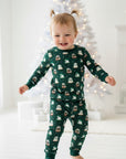 Child wearing pajamas with tiny snow globes